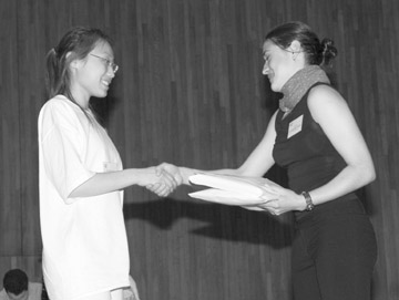 Catherine Reyes-Spencer (right), winner of the UMB Full Four Year Scholarship, congratulates Jennifer Ha, this year´s winner.
 