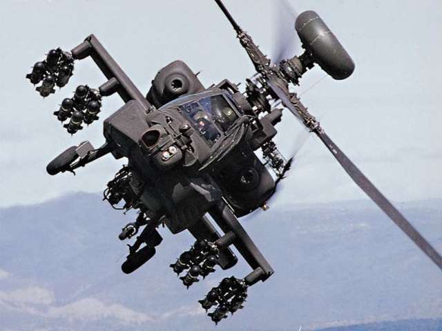 A+Boeing+AH-64+Apache+helicopter+in+flight%2C+one+of+the+machines+accused+of+being+used+for+war+crimes.