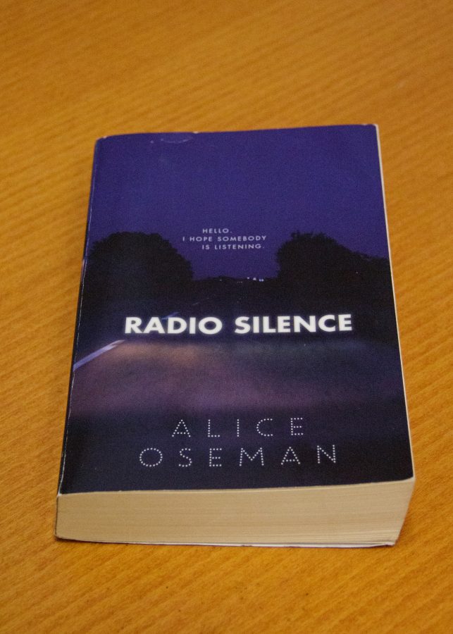 “Radio Silence” by Alice Oseman sits upon a desk.