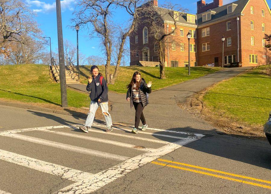 Two+pedestrians+use+a+crosswalk+on+the+UMass+Amherst+campus+on+Friday%2C+April+7%2C+2022.
