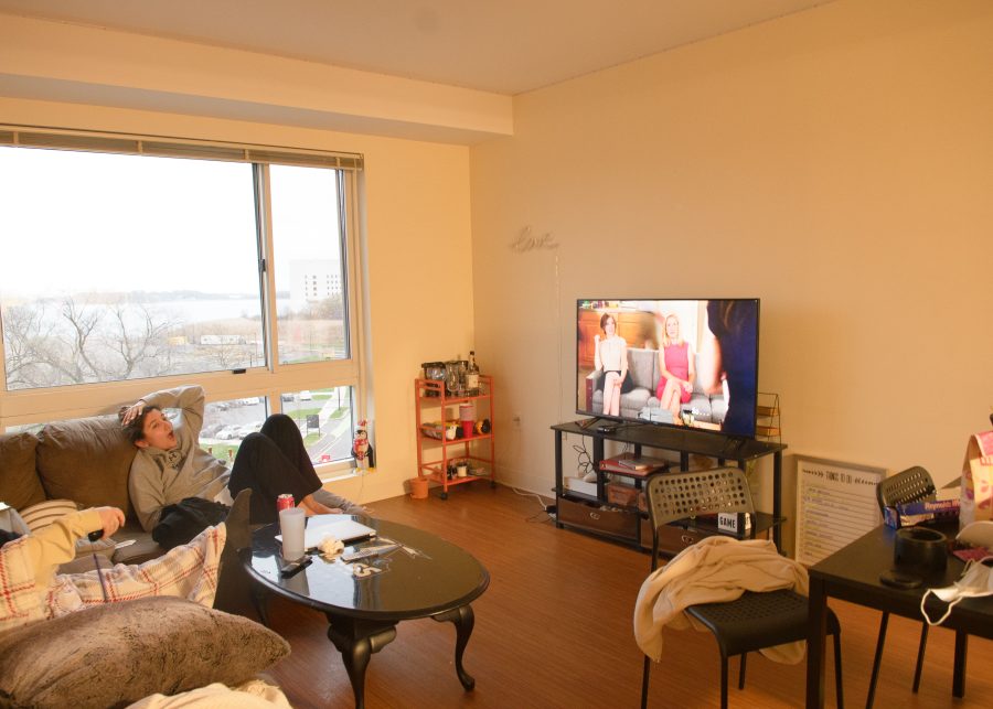 UMass Boston Student Jade H. watches “New Girl” in the comfort of her apartment with roommates.