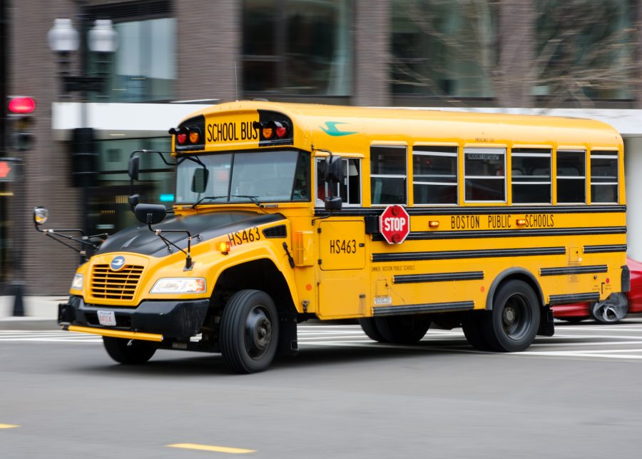 A+Boston+Public+School+bus+drives+through+Broadway+Street+in+South+Boston.