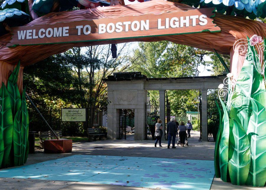 A+family+walks+into+Franklin+Park+Zoo+in+anticipation+of+Boston+Lights.