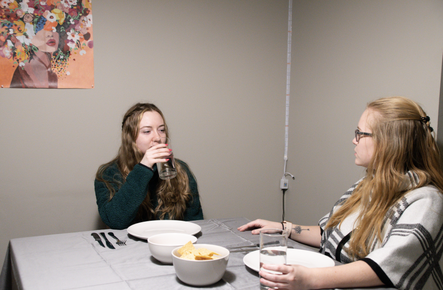 Amanda and Julianna sit down to enjoy a nice dinner. Photo by Caitlin Feest (She/Her) / Mass Media Contributor. 