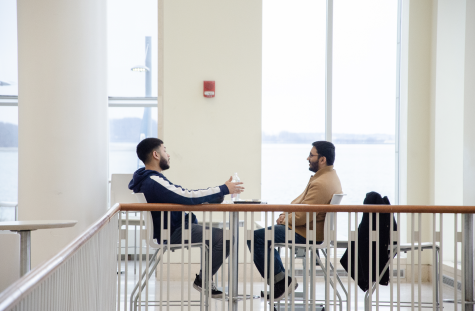 Two students have a conversation in the Campus Center. Photo by Saichand Chowdary (He/Him) / Mass Media Staff.