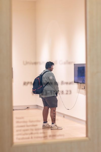 A student views “RPM: Room to Breathe” located in the University Hall Gallery on the first floor. Photo by Colin Tsuboi / Mass Media Staff.