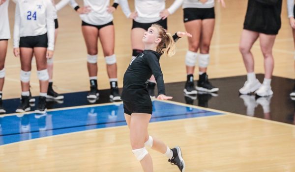 Lauren Westlund spikes the ball during against Saint Joseph’s College. Photo by Beacon Athletics.
