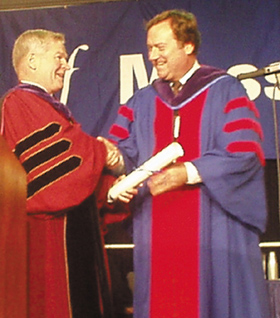 UMass President William Bulger Presents renowned journalist Tim Russert with an honorary degree.
 