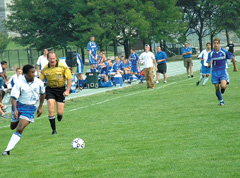 Forward Edward Dominique races down the sideline late in the second half of Saturday´s soccer match against St. Joseph´s of Maine. UMass Boston won 1 to 0
 