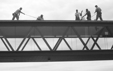 Workers atop the walkway. - photo by Kory Vergets
 