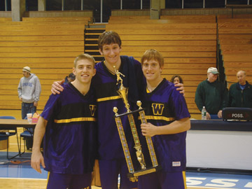 The tri-captains of Williams College with the first place trophy of the Harbor Invitational. Eric Summerville, with his UMB teammates, holds up the second place trophy.
 