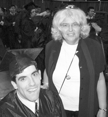 Professor Ann Withorn with a student before graduation. - Photo by Gintautas Dumcius
 