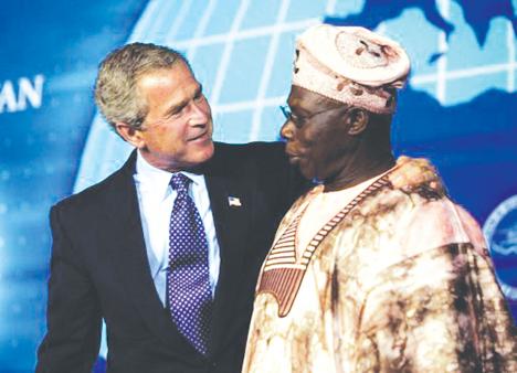 Nigerian President Olusegun Obasanjo, right, with President George W. Bush, at a July 2003 summit in Nigeria. Obasanjo is expected to give a speech at UMass Boston that will mention the Sudanese crisis.
 