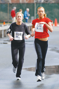 Beth Lentini(left) and Melanie Wigmanich competer for 29th place in the Beacon Dash 5k. Lentini finished 0.1 second ahead
 