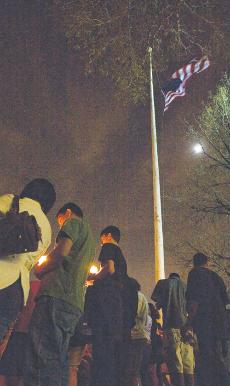 Students hold candlelight vigil in remembrance of those killed.
 