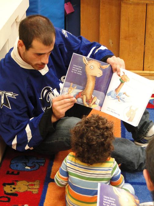 Jimmy Ennis reads to the children of the UMBs Early Learning
Center.
