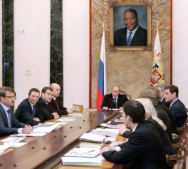 Former Soviet leaders meet while a picture of a familiar face hangs on the wall.