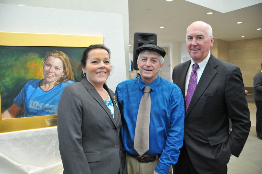 Patricia and William Campbell (left), and Trustee Richard Campbell (right) in front of Krystal Campbell's memorial portrait