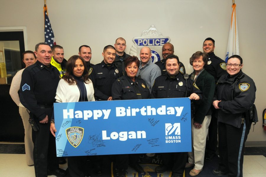 UMass+Boston+Public+Safety+officers+with+a+poster+that+was+given+to+Logan+Pearson