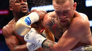 Floyd Mayweather (left) and Conor McGregor (right) during their Aug. 26 bout that sold 4.8 million pay-per-views.
