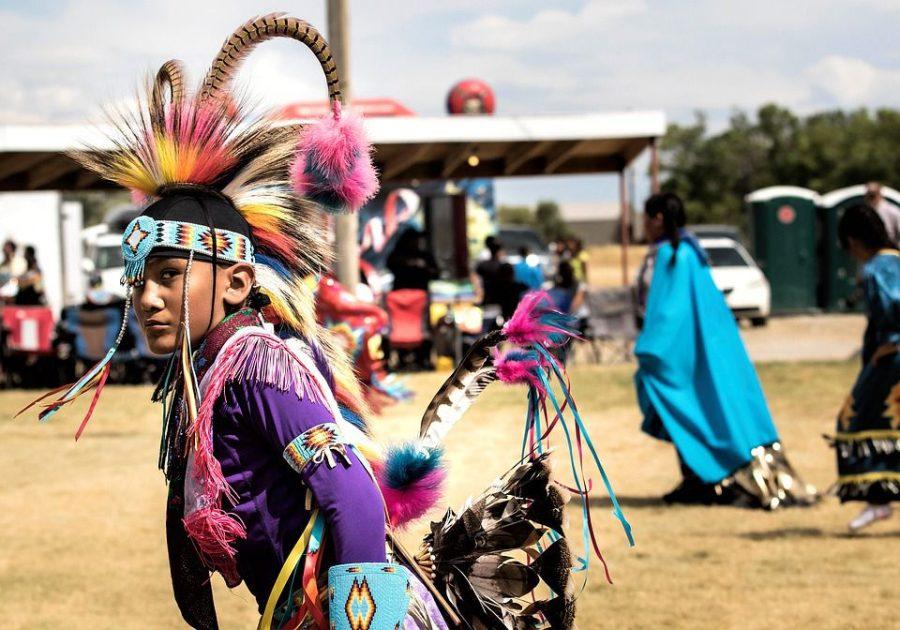 A Native American of the Arapahoe Nation in traditional dress at a pow wow.