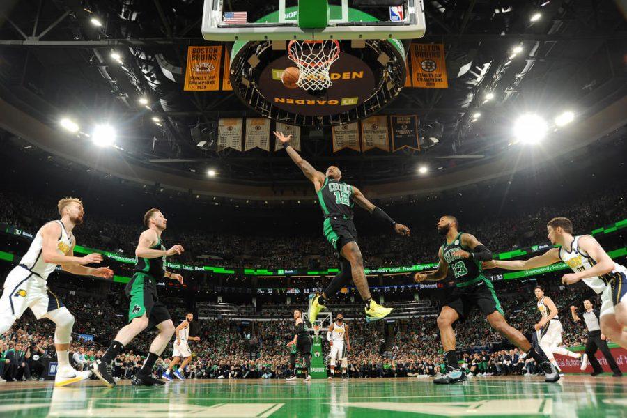 BOSTON, MA - APRIL 14: Terry Rozier #12 of the Boston Celtics goes up for a rebound against the Indiana Pacers during Game One of Round One of the 2019 NBA Playoffs on April 14, 2019 at the TD Garden in Boston, Massachusetts. NOTE TO USER: User expressly acknowledges and agrees that, by downloading and or using this photograph, User is consenting to the terms and conditions of the Getty Images License Agreement. Mandatory Copyright Notice: Copyright 2019 NBAE (Photo by Brian Babineau/NBAE via Getty Images)