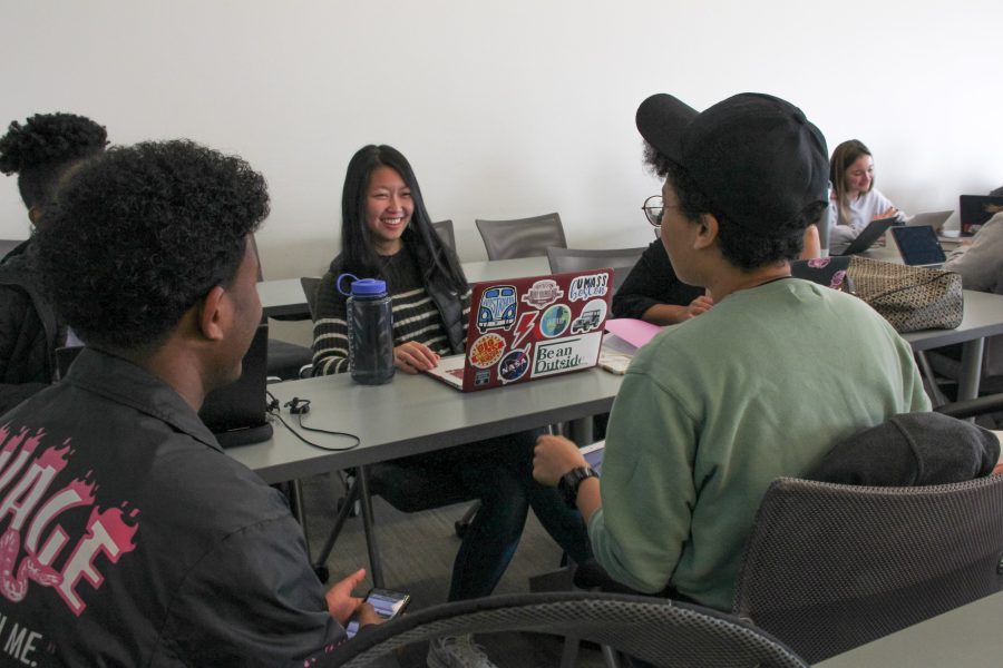 Students participate in a discussion portion of their class on the 3rd floor of UHall.