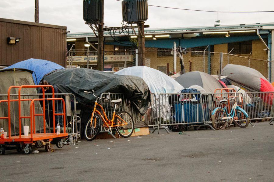 A slew of tents line the streets off of Massachusetts Avenue, with peoples belongings out in the open.