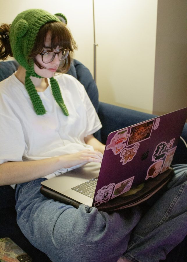 UMass Boston student Dana A., a sophomore, studies for finals from the comfort of her couch for hours on end.