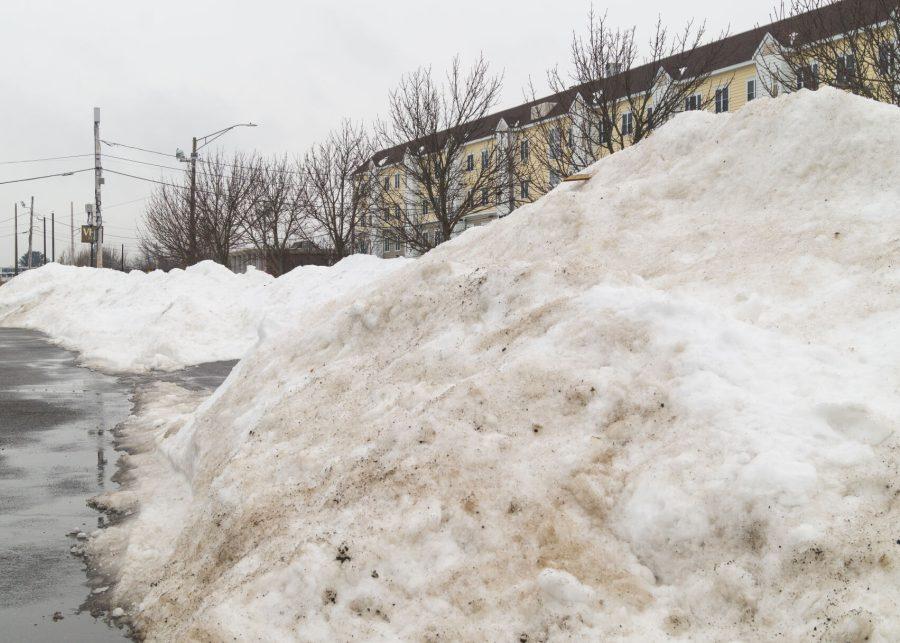 Piles of snow sit after record blizzard hits Massachusetts.
