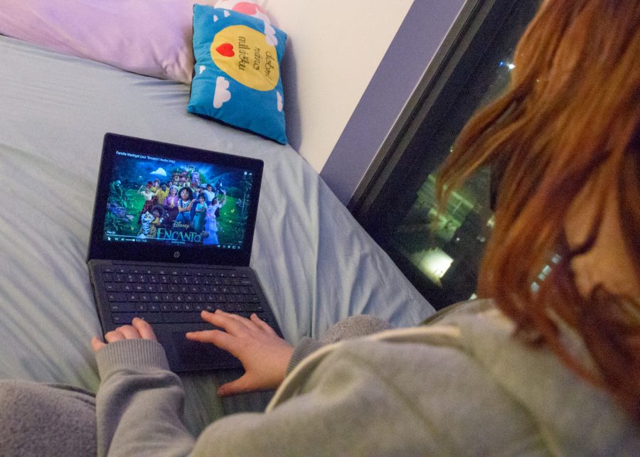 UMass Boston student Sofia P. watches “Encanto” in her dorm on Tuesday, March 29, 2022.