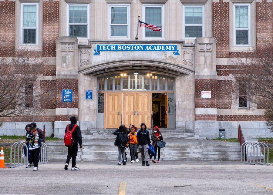 Students at TechBoston Academy in Dorchester, Mass. leave the building after a school day on Thursday, March 31, 2022.