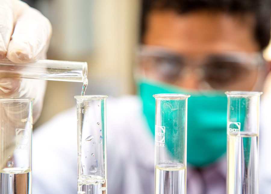 A scientist performs tests on samples.