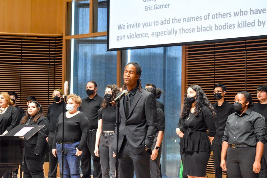 Eric M. Anderson, Director of Communications and Special Projects with the Transformational Prison Project, delivers a spoken word performance accompanied by the UMass Boston Chamber Singers in University Hall.