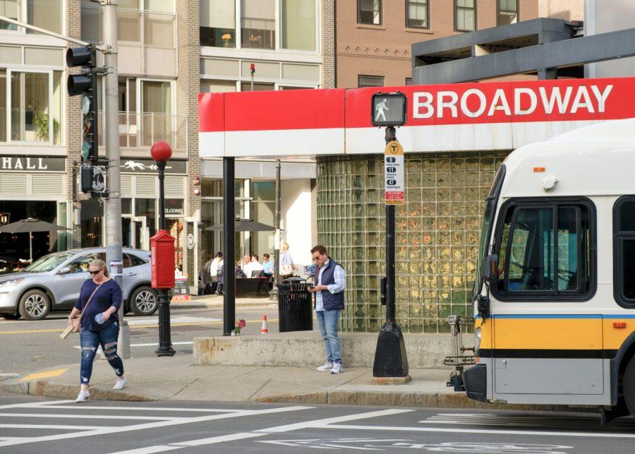An MBTA bus parks outside of the Broadway Red Line station in South Boston.