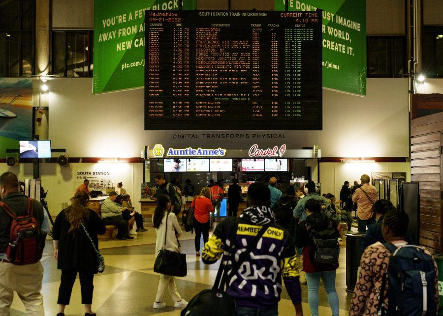 Passengers wait for their Amtrak train at South Station in Boston, Mass.