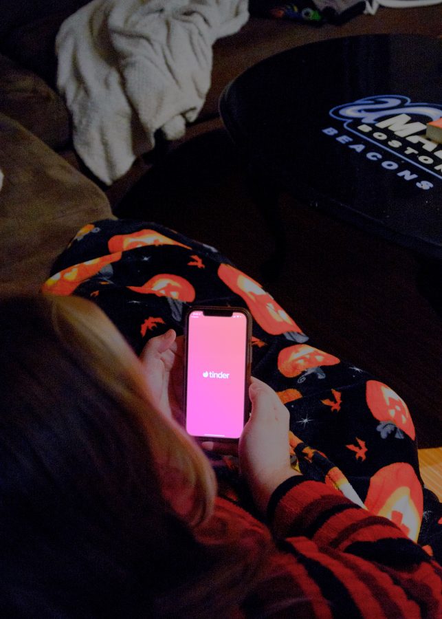 A student opens Tinder in hopes of meeting some people around the area.