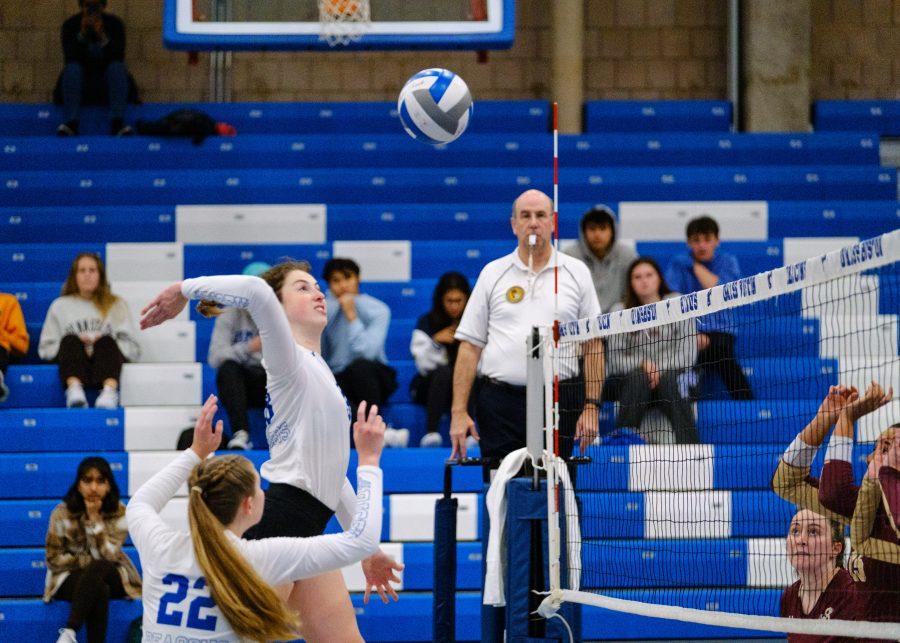 UMass Boston’s Taryn Broughal (#19) spiking in the game against URI, on Oct. 4, 2022.