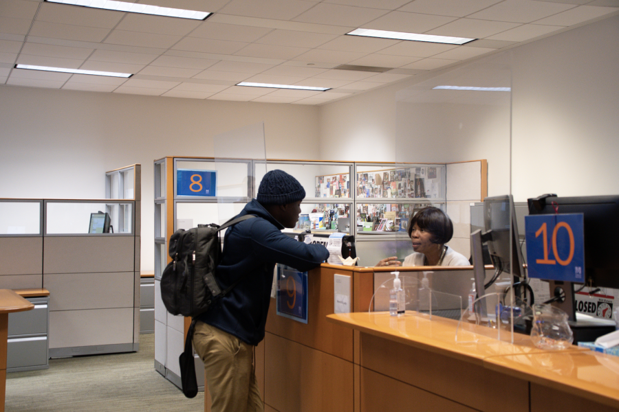 Student talks to financial aid office. Photo by Caitlin Feest (She/Her) / Mass Media Contributor. 