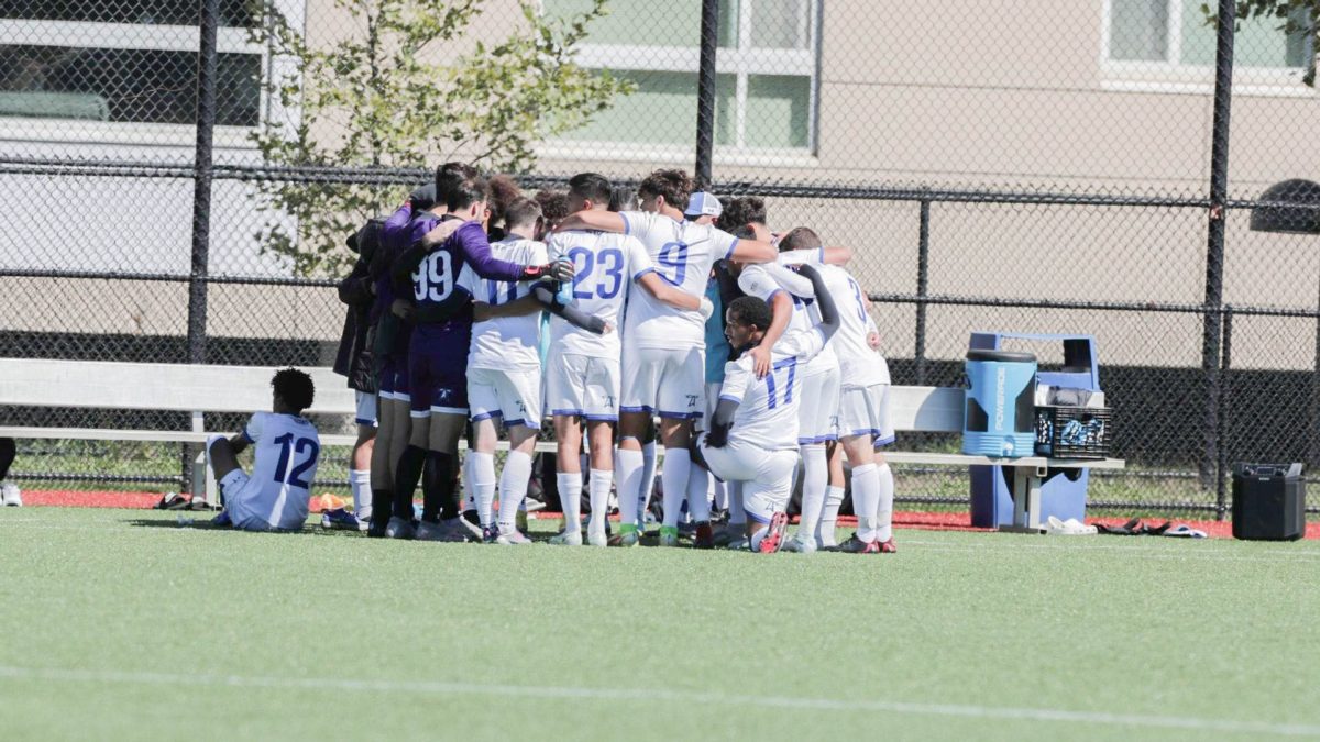 The UMass Boston Mens Soccer team huddles during the final stretch of the Fall 2022 season. Photo courtesy of Beacon Athletics. 