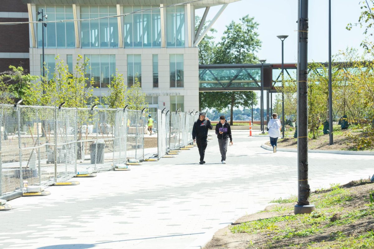 Campus construction is in full swing as members of the UMass Boston community walk by. Photo by Katrina Sanville (She/Her) / Editor-In-Chief.