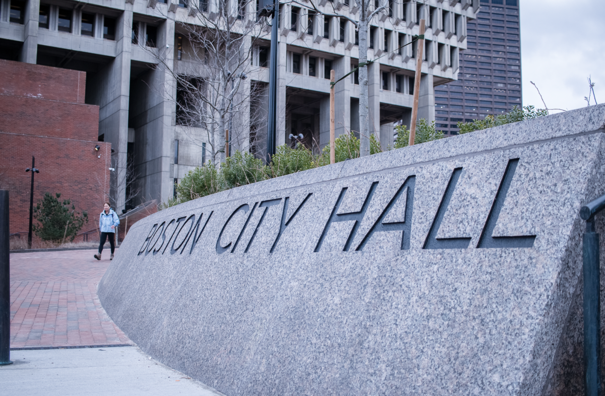 A+person+walks+by+Boston+City+Hall.+Photo+by+Colin+Tsuboi+%2F+Mass+Media+Staff.