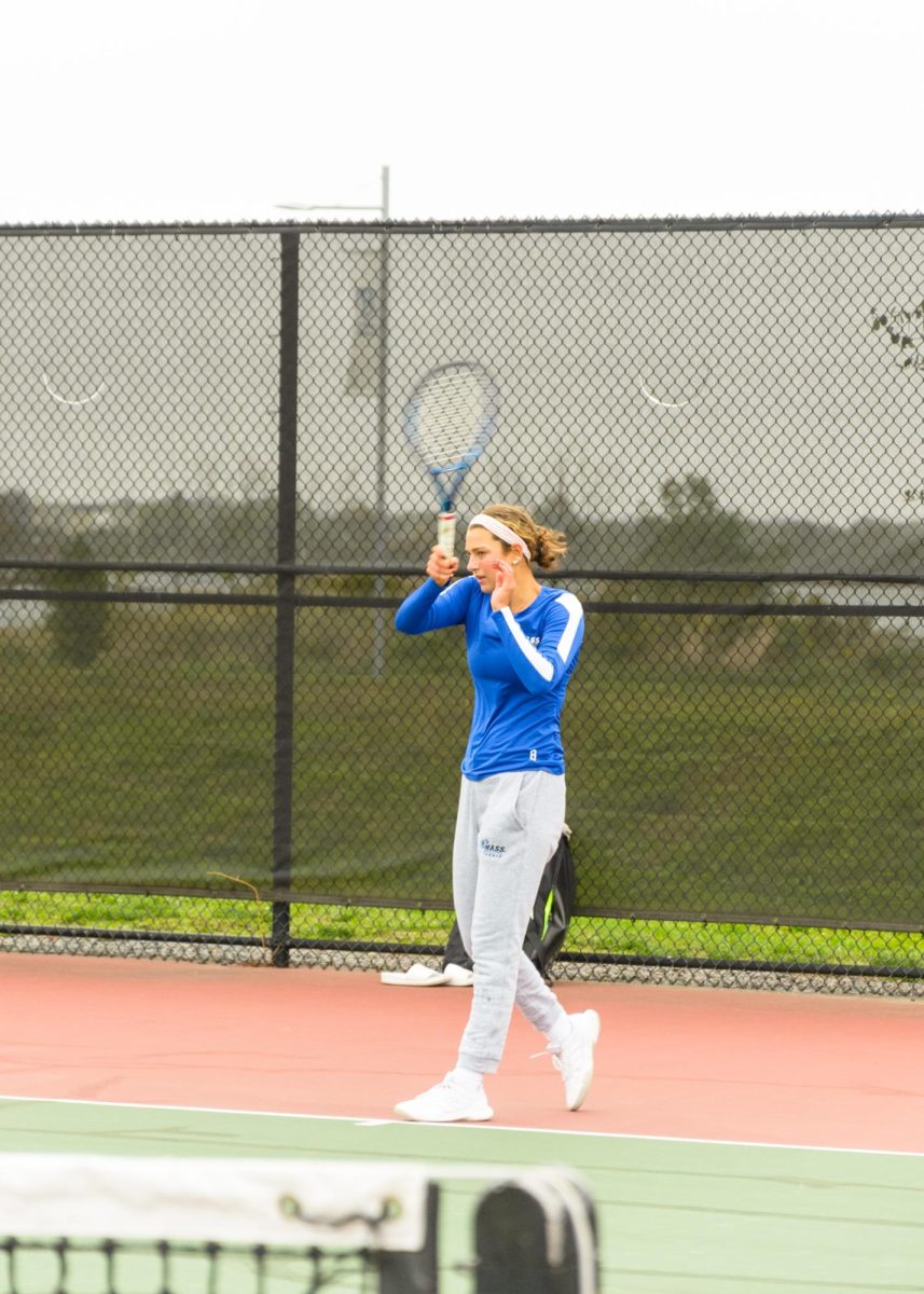 A women’s tennis players warms up before a game. Photo by Olivia Reid / Photography Editor.