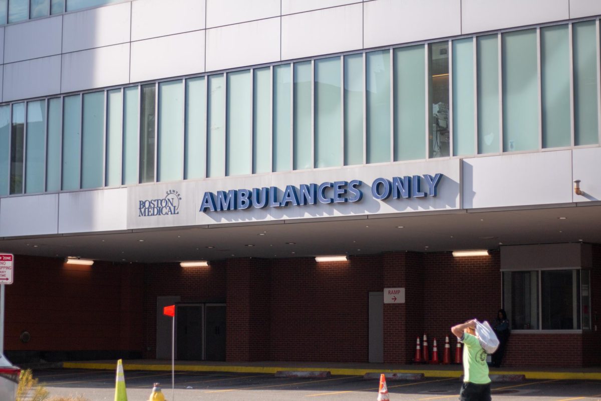 A person walks past Boston Medical Center. Photo by Colin Tsuboi / Mass Media Staff.