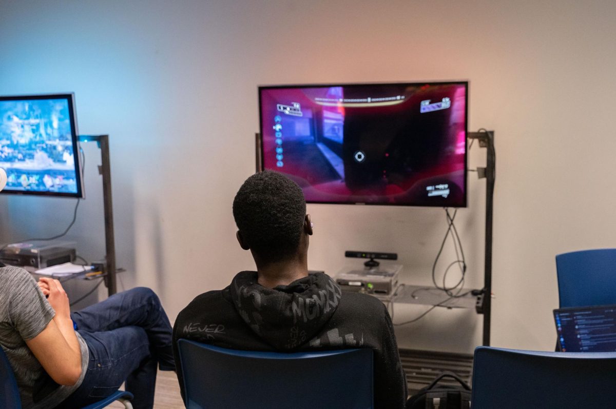Students in The Wave play video games in between classes. Photo by Olivia Reid / Photography Editor.