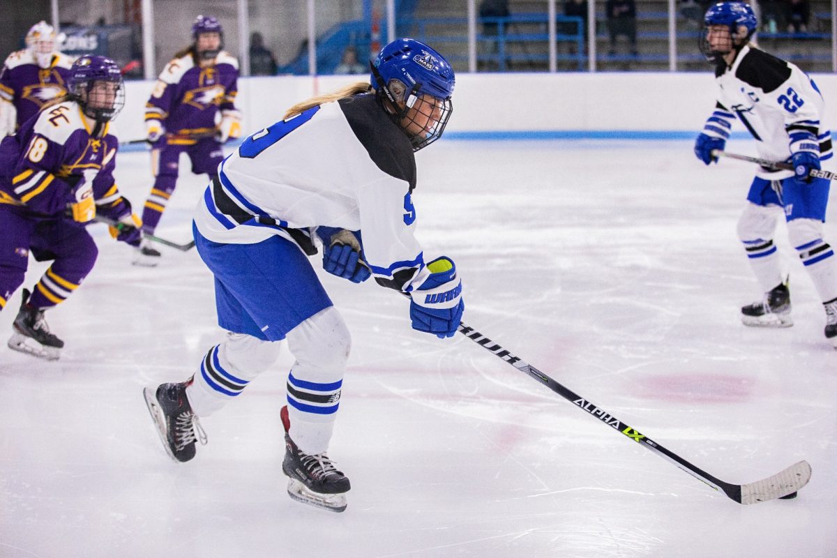 Women%E2%80%99s+hockey+forward+Allie+Reifer+controlls+the+puck+during+the+first+game+of+the+2023-2024+season.+Photo+by+Eliza+Nuestro+%2F+Beacons+Athletics.