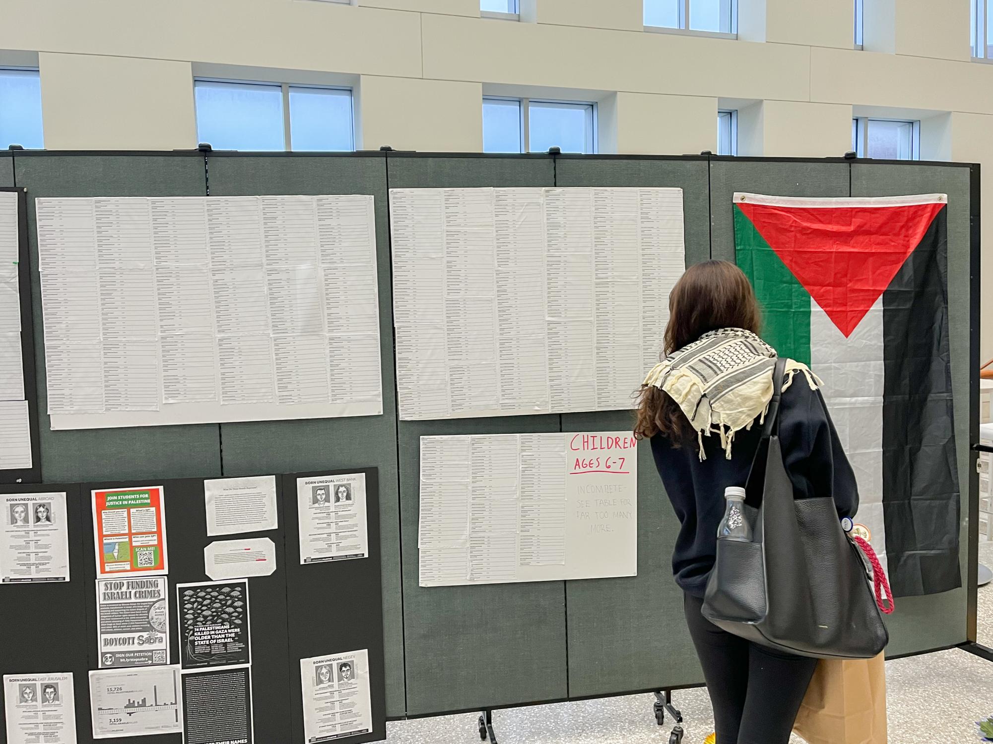 A student views the memorial for the marytrs of Gaza held in the Campus Center. 