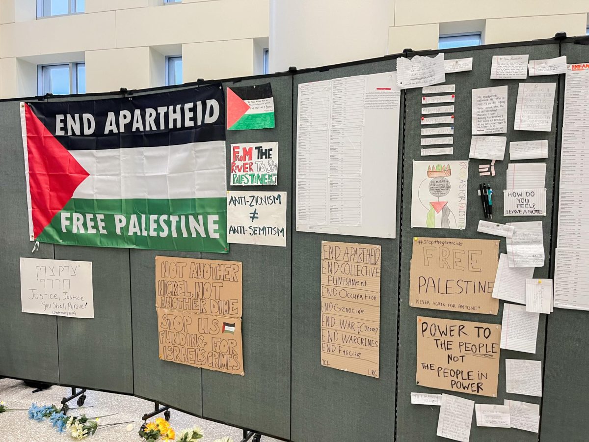 Posters+and+infographics+from+UMass+Boston%E2%80%99s+Students+for+Justice+in+Palestine%E2%80%99s+Memorial+for+Martys+of+Gaza+event.+Photo+by+Katrina+Sanville+%2F+Editor-in-Chief.