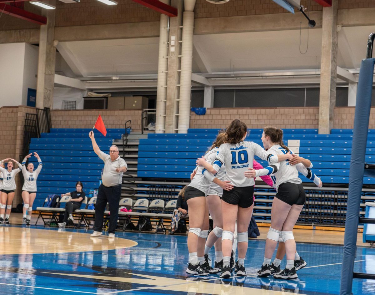 The Beacons celebrate after a victory against Keene State College. Photo by Olivia Reid / Photography Editor.