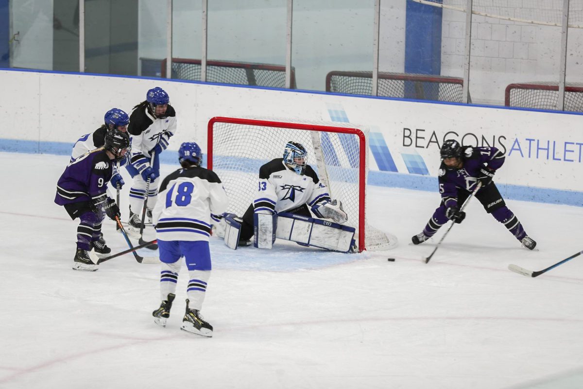 Goalie Leah Bosch guards the net against Amherst College at a home game. Photos by Dong Woo Im / Mass Media Staff.